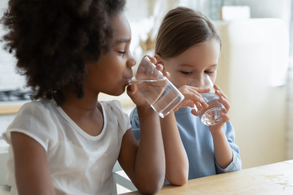 Young girls drinking water.